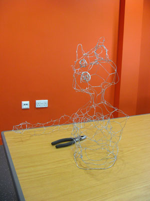 Look at this funky feline wire sculpture!